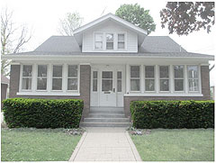 A house with prickly hedges below the windows which help prevent break-ins via the windows