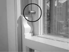 Window with sash stop screw